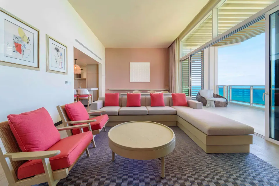 Ocean suite living room opening to the balcony at Wyndham Grand Barbados Sam Lords Castle.