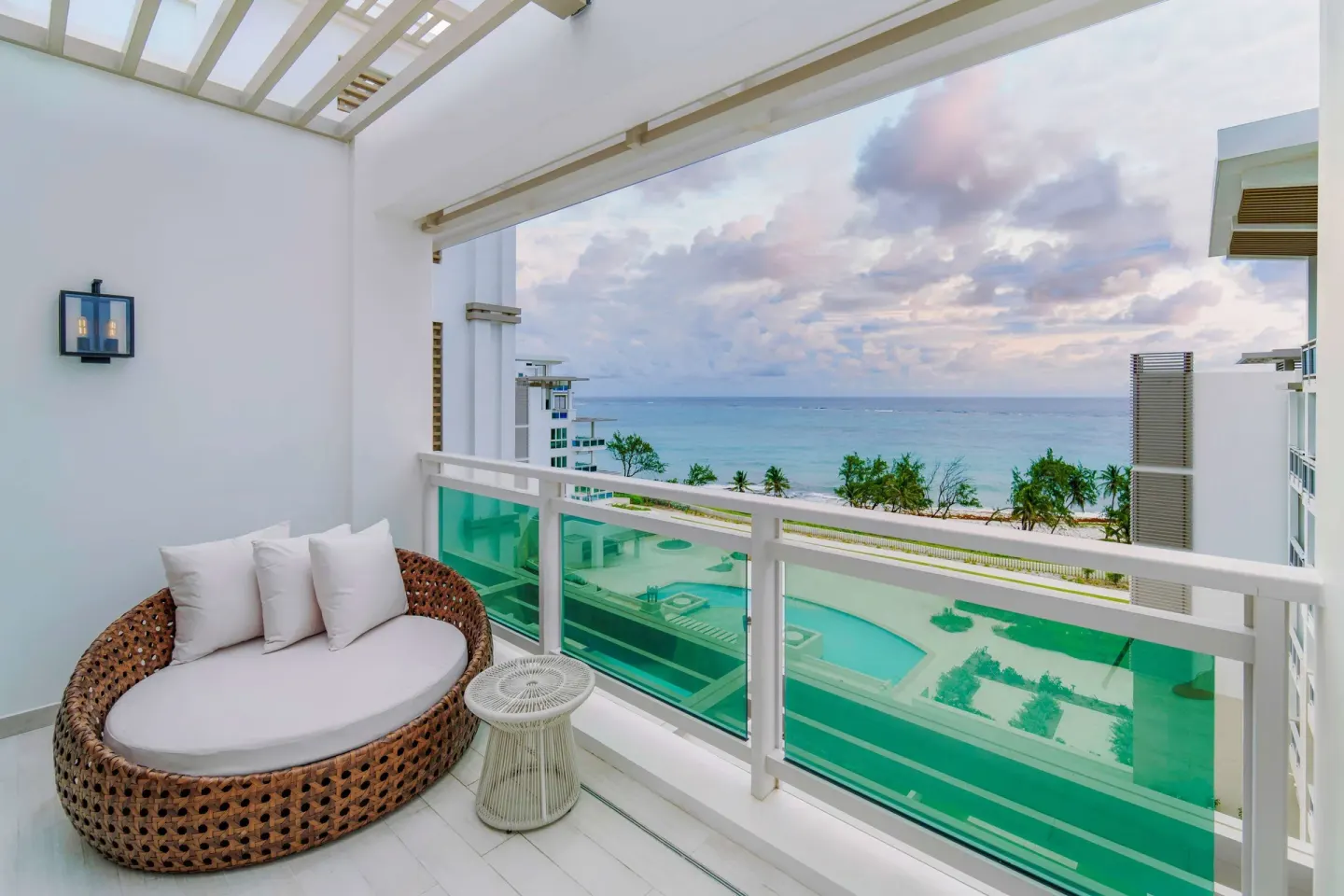 Zephyr Suite balcony daybed with ocean view at Wyndham Grand Barbados Sam Lords Castle.