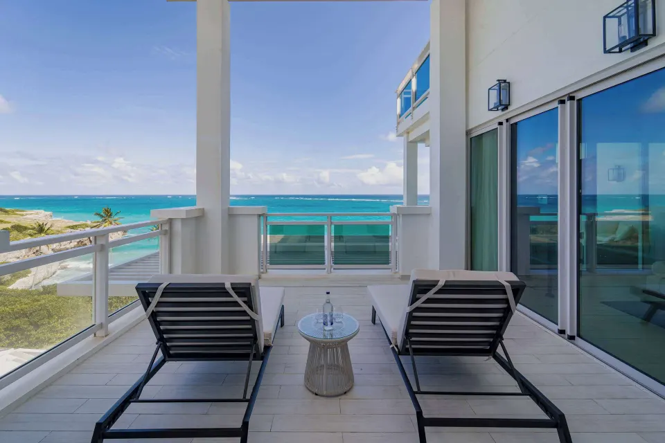 Zephyr Suite balcony loungers overlooking the ocean at Wyndham Grand Barbados Sam Lords Castle.