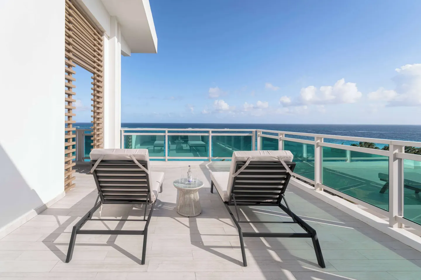 Zephyr Suite sun terrace loungers facing the ocean at Wyndham Grand Barbados Sam Lords Castle.
