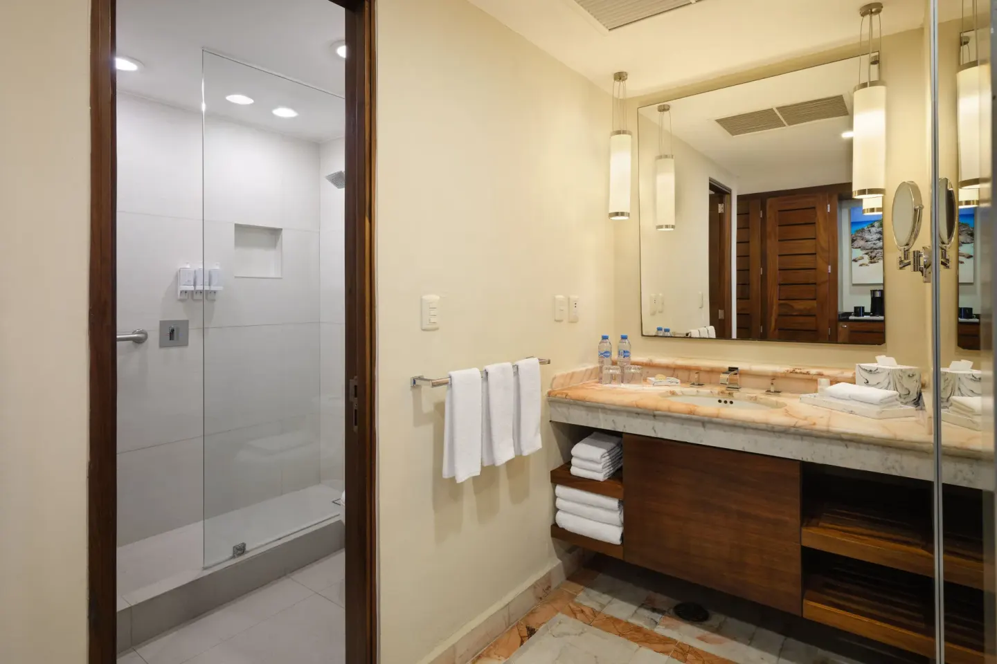Bathroom vanity and glass shower at Wyndham Grand Cancun Resort & Villas.