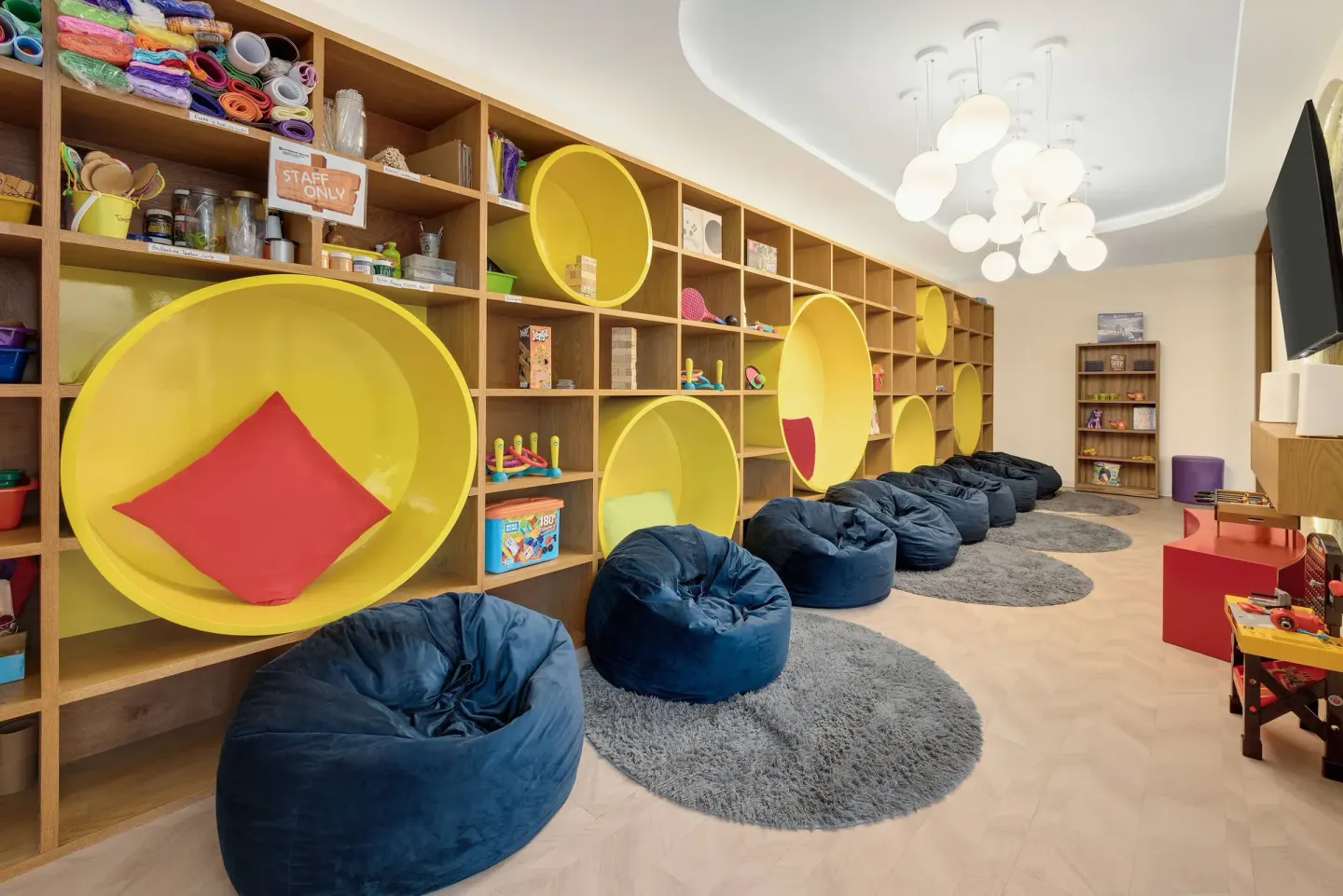 Kids club reading nooks and beanbag seating at Wyndham Grand Cancun Resort & Villas.