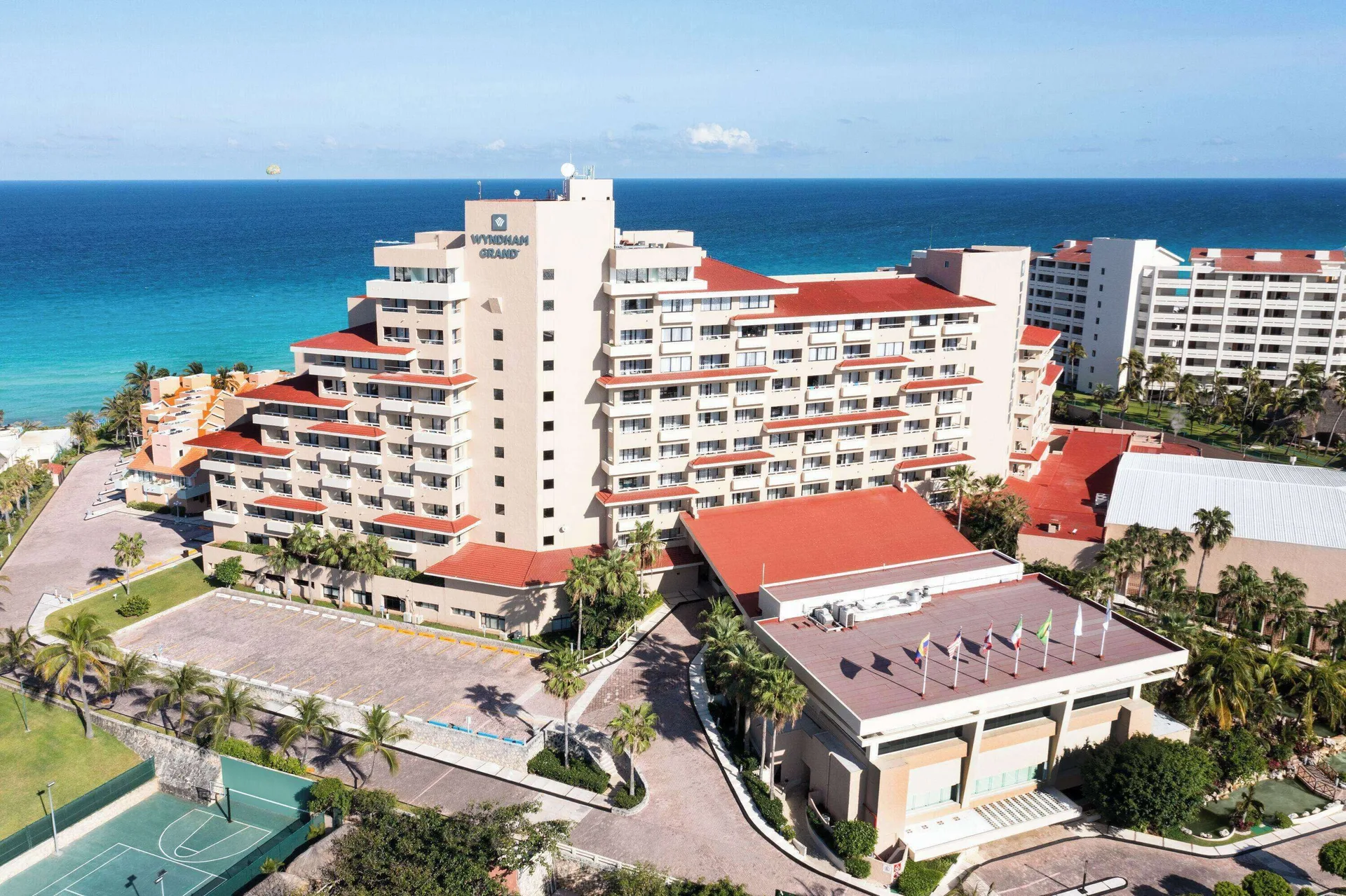 Daytime aerial view of the oceanfront tower at Wyndham Grand Cancun Resort & Villas.