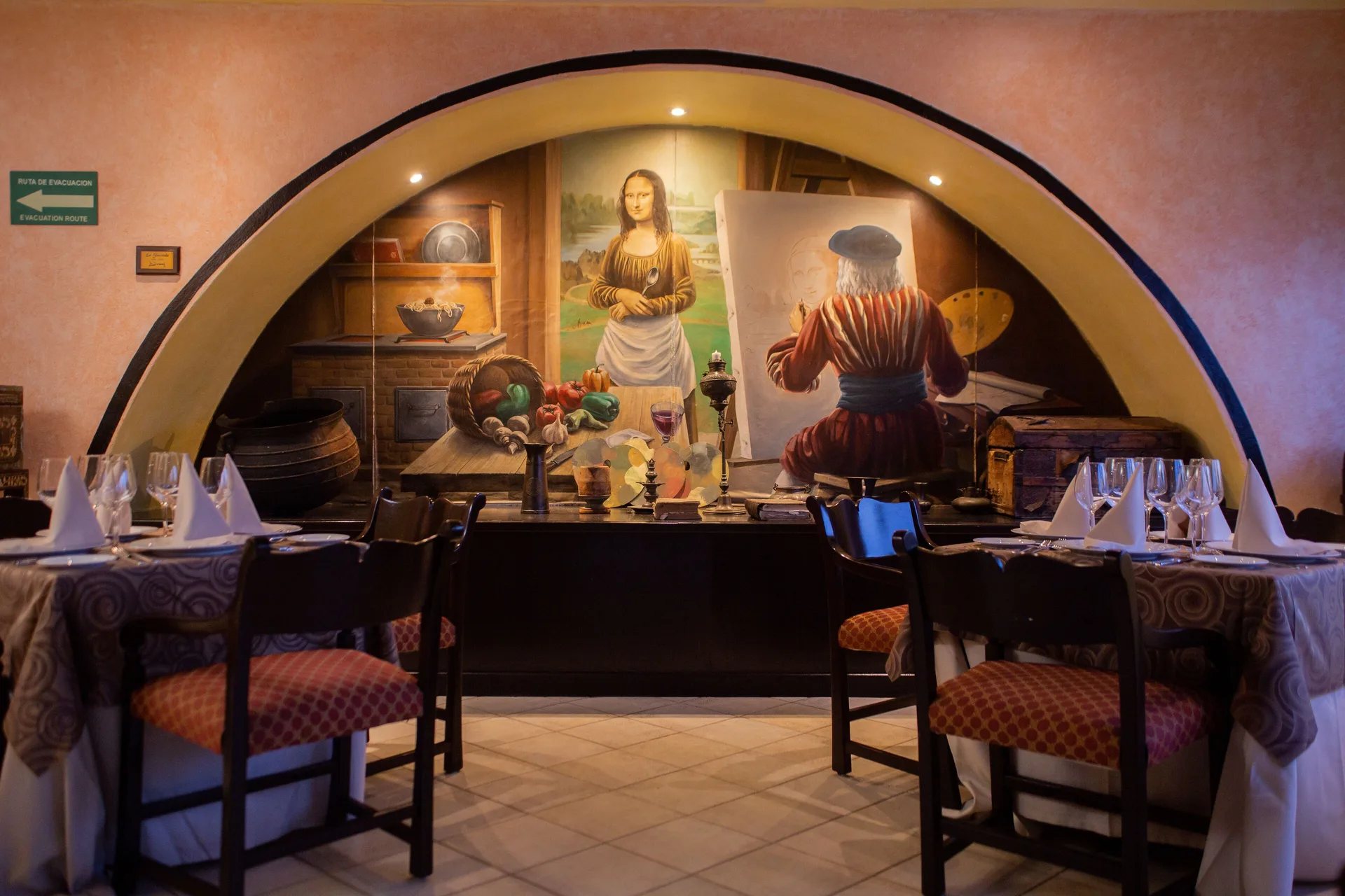 Italian-style dining room mural at Wyndham Grand Cancun Resort & Villas with set tables.