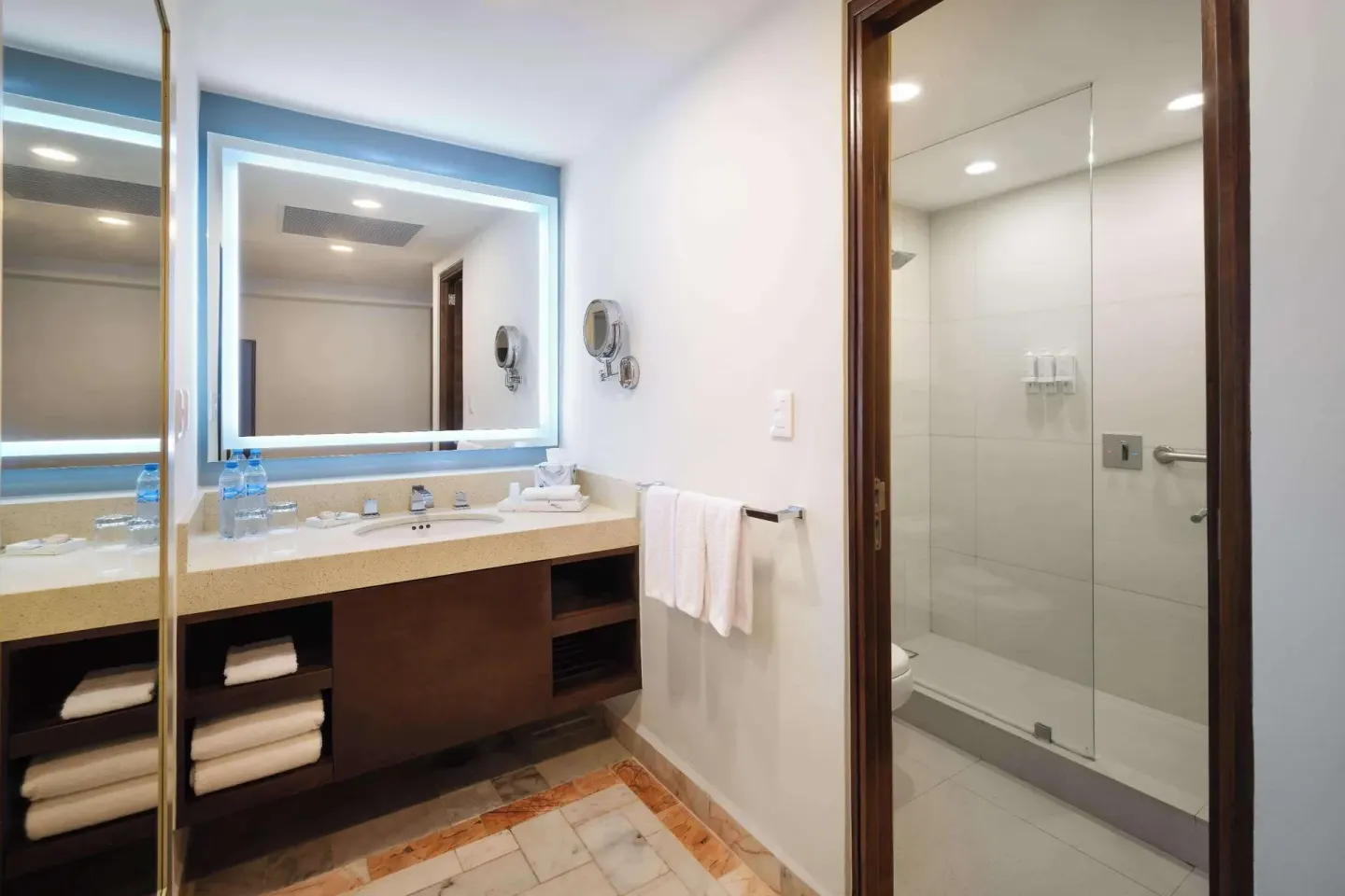 Superior Lagoon View bathroom vanity and shower at Wyndham Grand Cancun Resort & Villas.