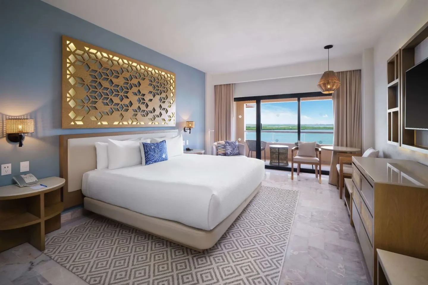 Superior Lagoon View king bed room at Wyndham Grand Cancun Resort & Villas.