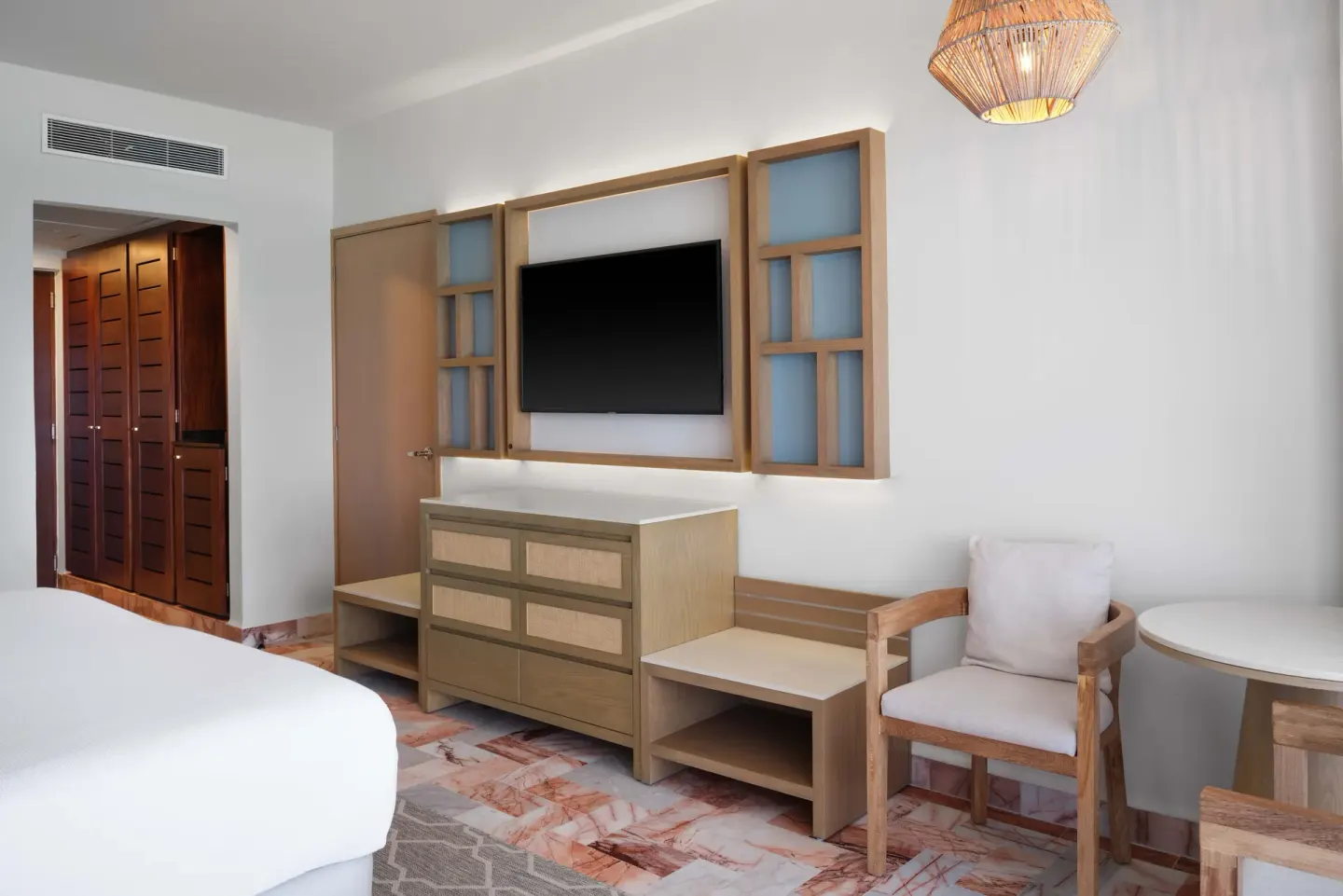 Superior Ocean View room seating and TV area at Wyndham Grand Cancun Resort & Villas.