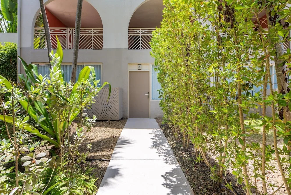 Garden walkway to guest room doors at Wyndham Palmas Beach and Golf Boutique Resort.