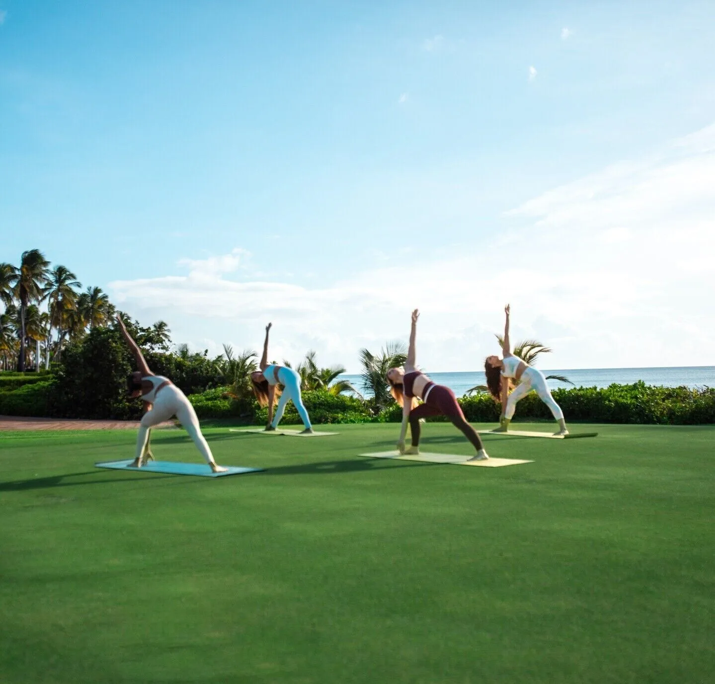 Outdoor yoga class by the ocean at Wyndham Palmas Beach and Golf Boutique Resort.