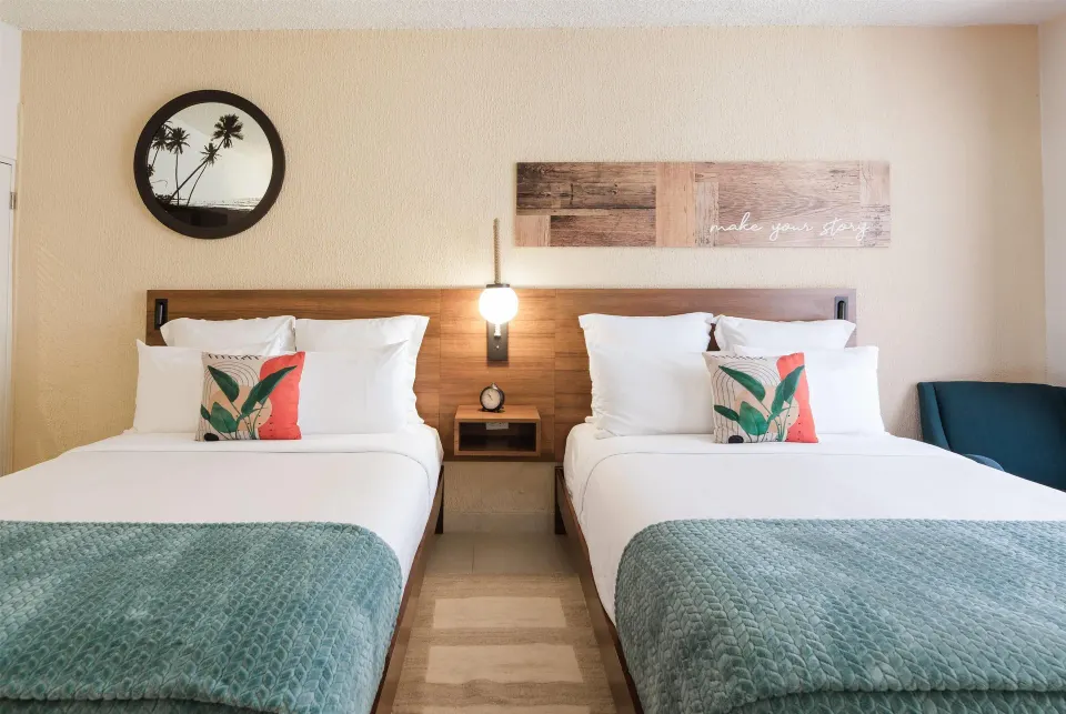 Two queen beds in a Garden View room at Wyndham Palmas Beach and Golf Boutique Resort.