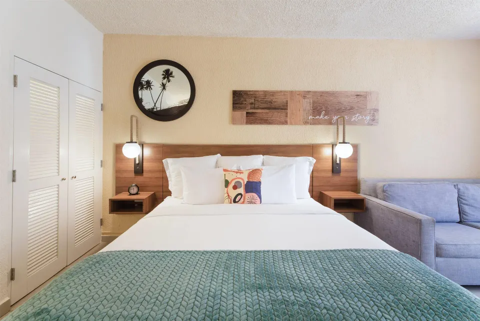 Poolside non-smoking room with king bed and sofa at Wyndham Palmas Beach and Golf Boutique Resort.