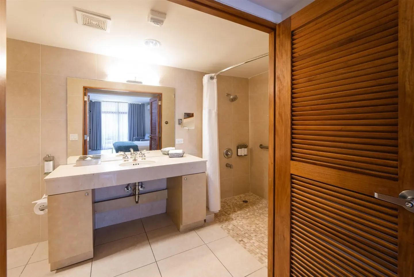 Studio Resort View bathroom at Wyndham Palmas Beach and Golf Boutique Resort with vanity and shower.