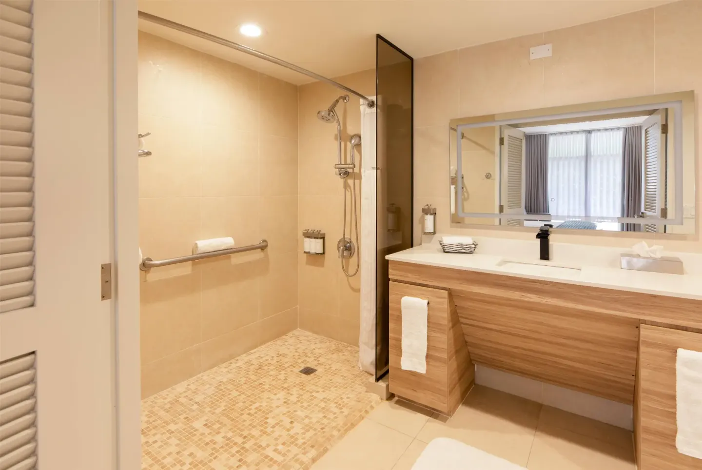Suite bathroom with walk-in shower and double-sink vanity at Wyndham Palmas Beach and Golf Boutique Resort.