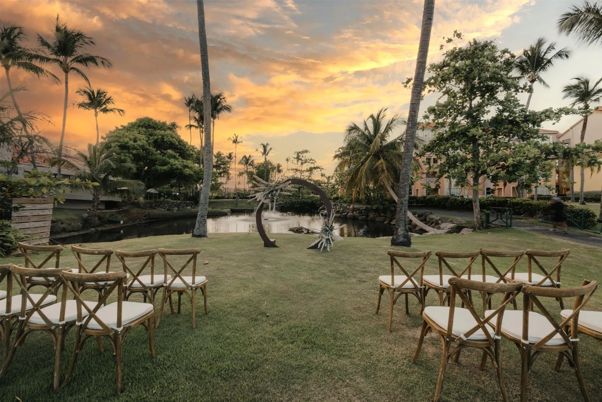 Lawn wedding ceremony setup by the lagoon at Wyndham Palmas Beach and Golf Boutique Resort.