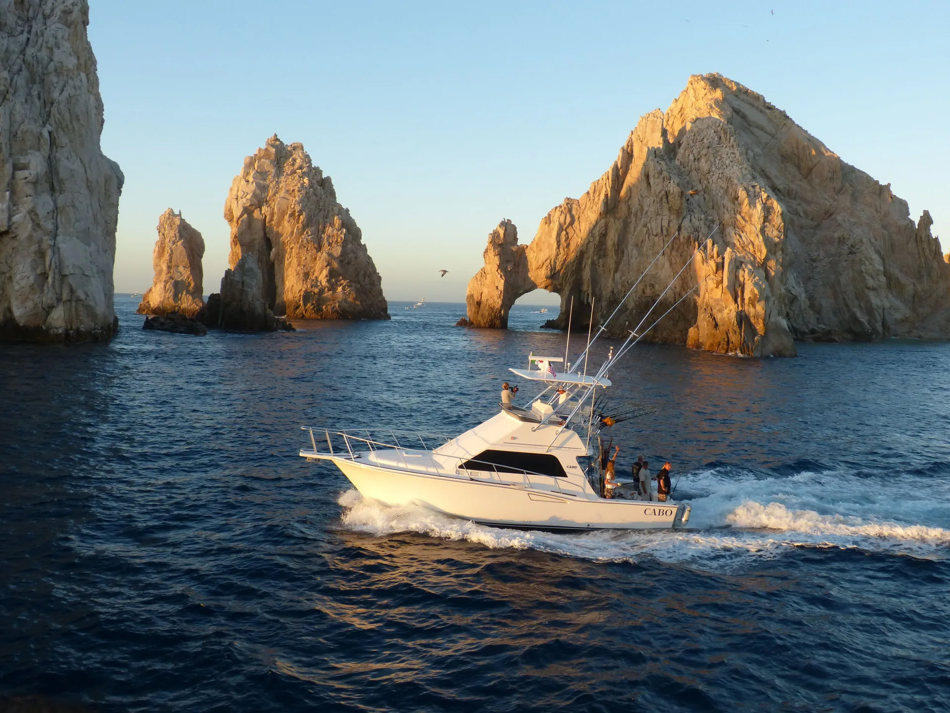 A sportfishing boat passes Cabo rock formations near Zadún, a Ritz-Carlton Reserve, Los Cabos.