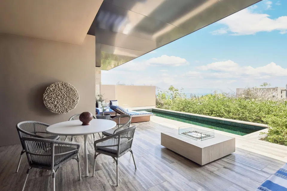 Covered terrace with plunge pool and dining table at Zadún, a Ritz-Carlton Reserve, Los Cabos.