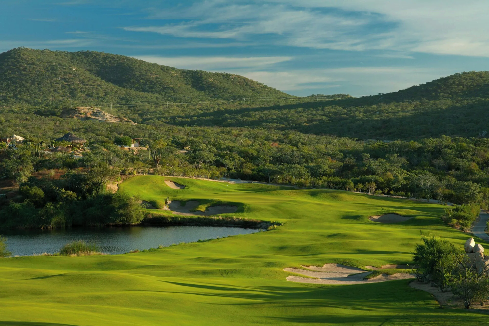 A green golf course runs through desert hills near Zadún, a Ritz-Carlton Reserve, Los Cabos.