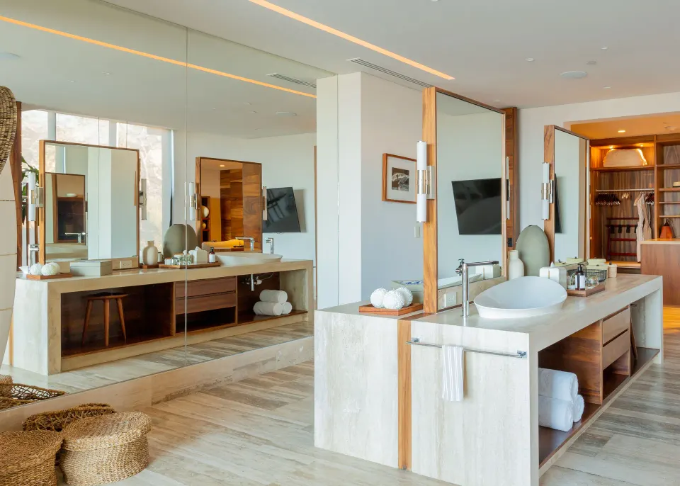 Guest bathroom with double vanity and wardrobe at Zadún, a Ritz-Carlton Reserve, Los Cabos.