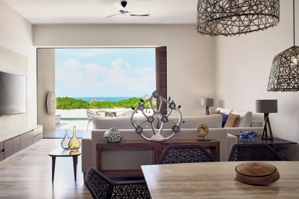 Living and dining area with ocean-view terrace at Zadún, a Ritz-Carlton Reserve, Los Cabos.