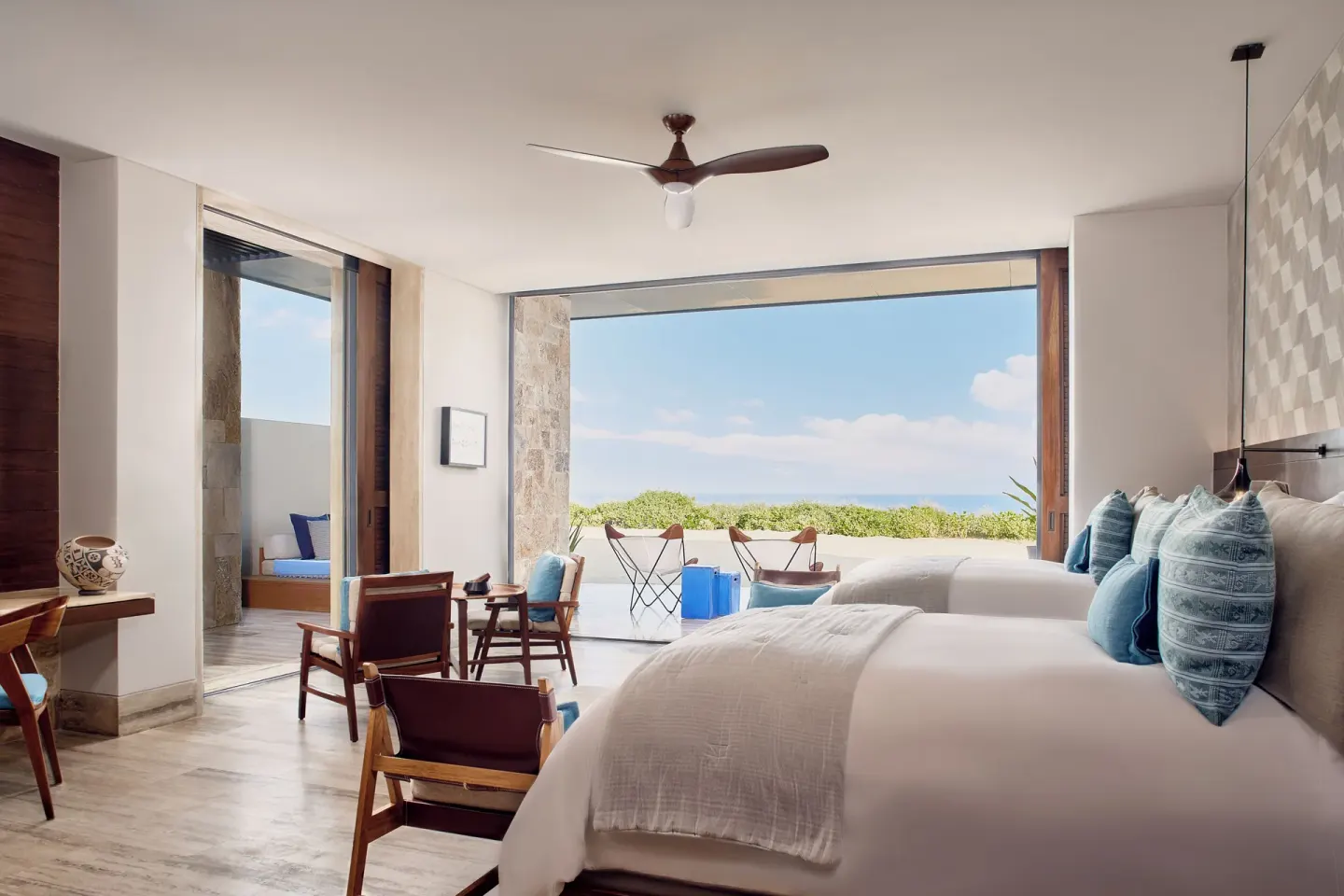 Twin-bed guest room with terrace and ocean view at Zadún, a Ritz-Carlton Reserve, Los Cabos.