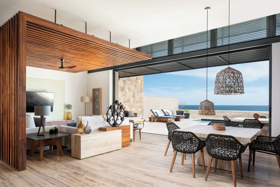 Open living and dining area with ocean-facing terrace at Zadún, a Ritz-Carlton Reserve, Los Cabos.