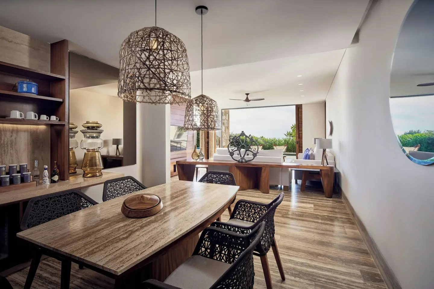 Dining area and lounge in a suite at Zadún, a Ritz-Carlton Reserve, Los Cabos.