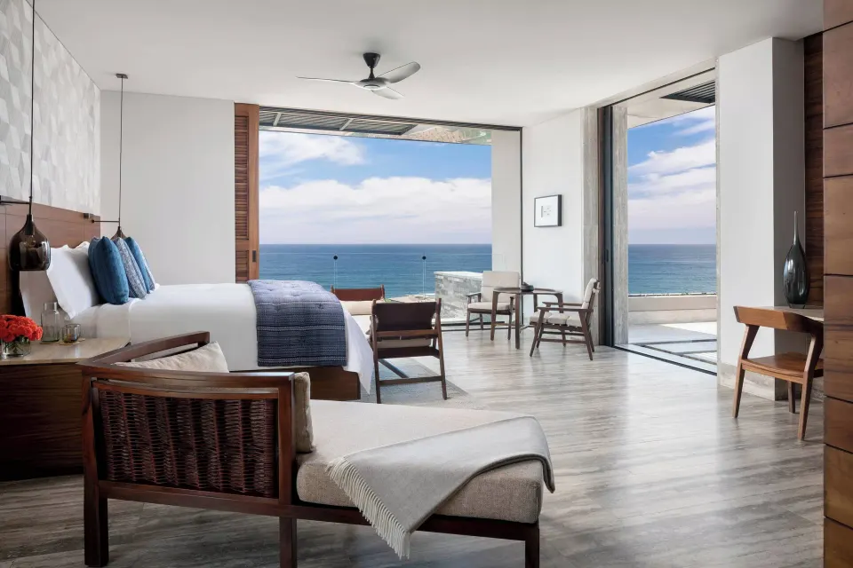 Ocean-view king guest room with terrace seating at Zadún, a Ritz-Carlton Reserve, Los Cabos.