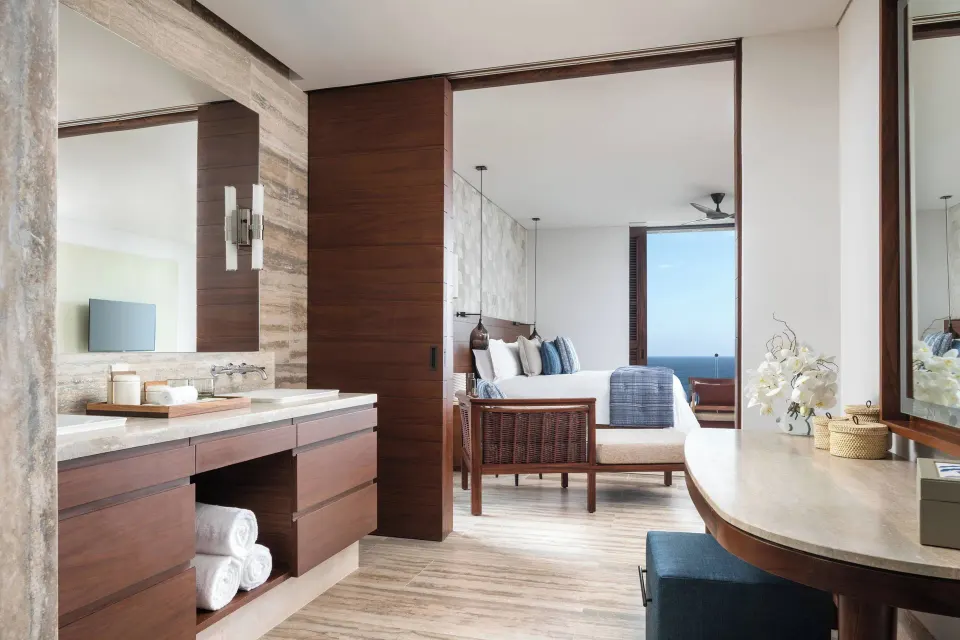 Bathroom vanity opening to an oceanfront two-bed room at Zadún, a Ritz-Carlton Reserve, Los Cabos.