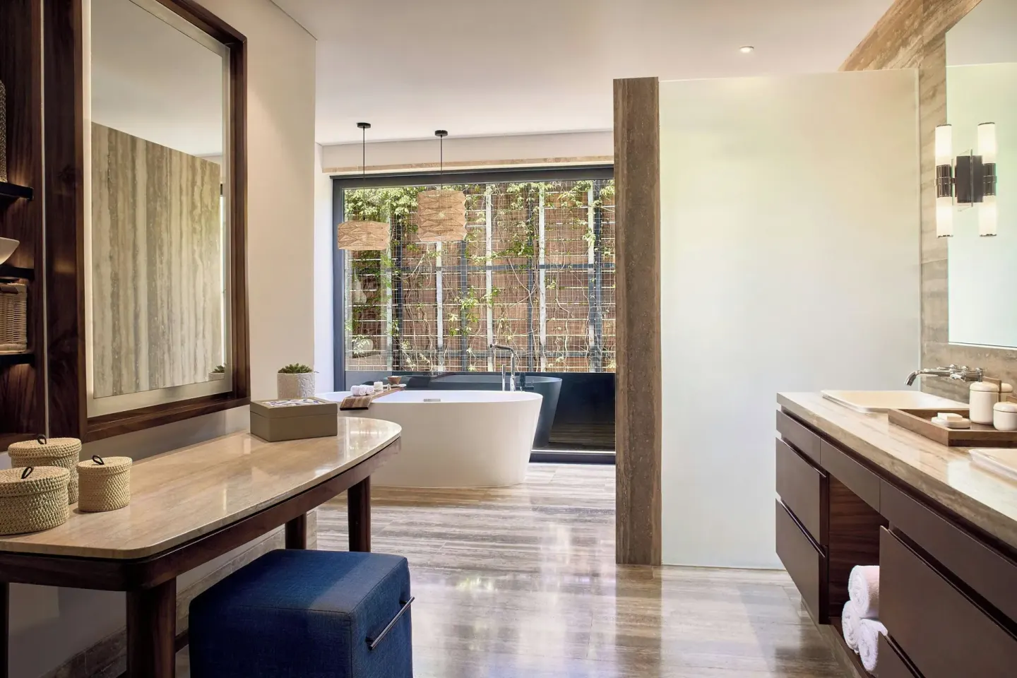Bathroom vanity and freestanding tub in a guest room at Zadún, a Ritz-Carlton Reserve, Los Cabos.