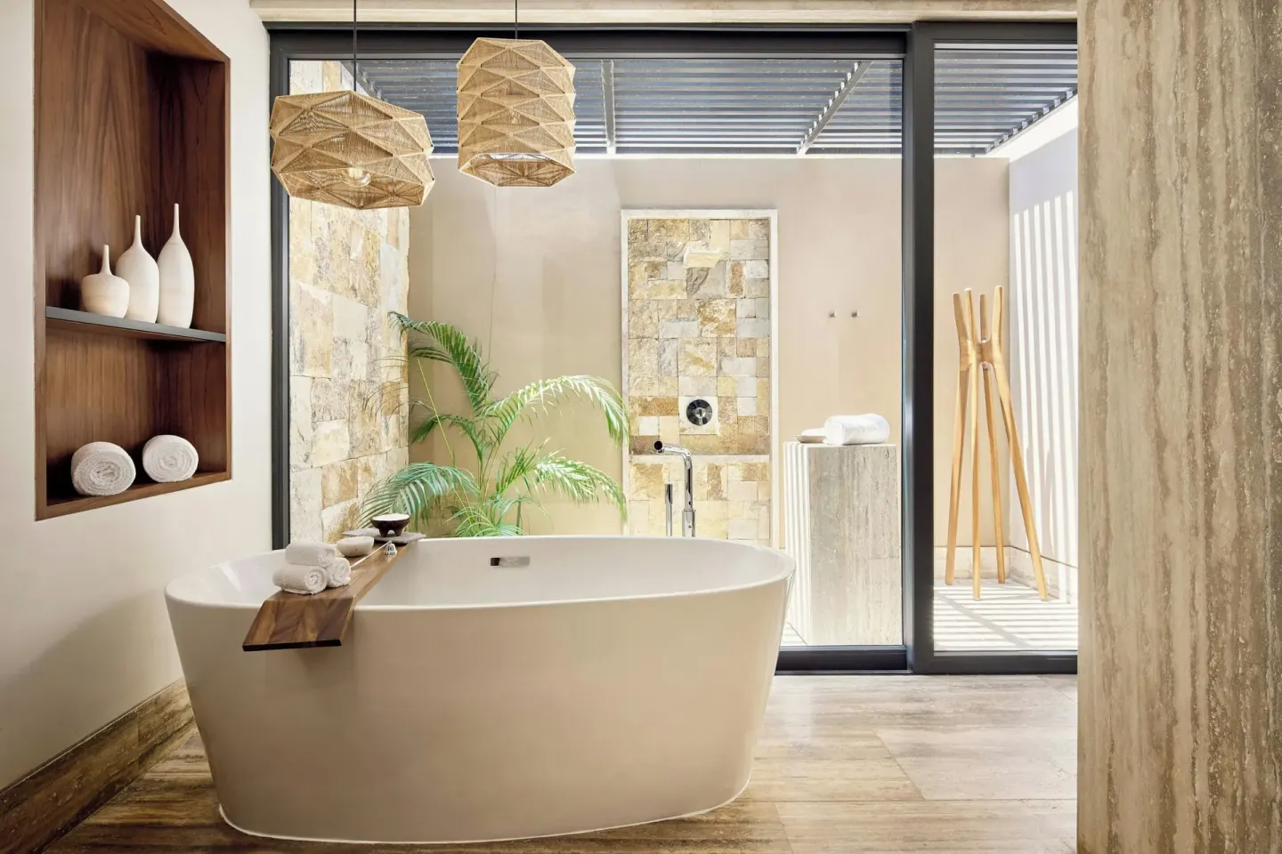 Freestanding tub facing an outdoor shower area at Zadún, a Ritz-Carlton Reserve, Los Cabos.