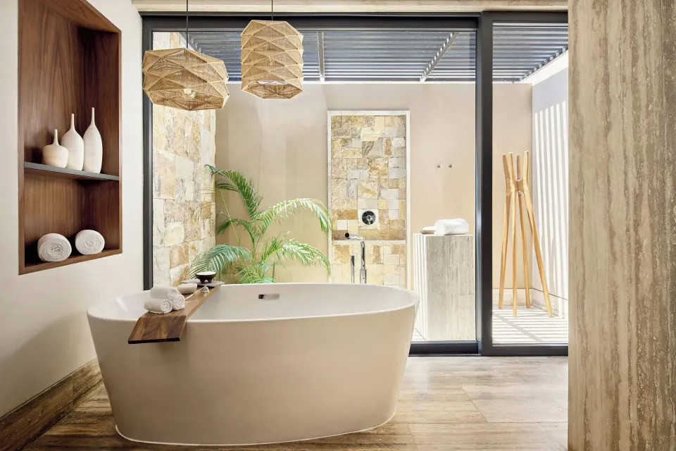 Freestanding tub facing an outdoor shower area at Zadún, a Ritz-Carlton Reserve, Los Cabos.
