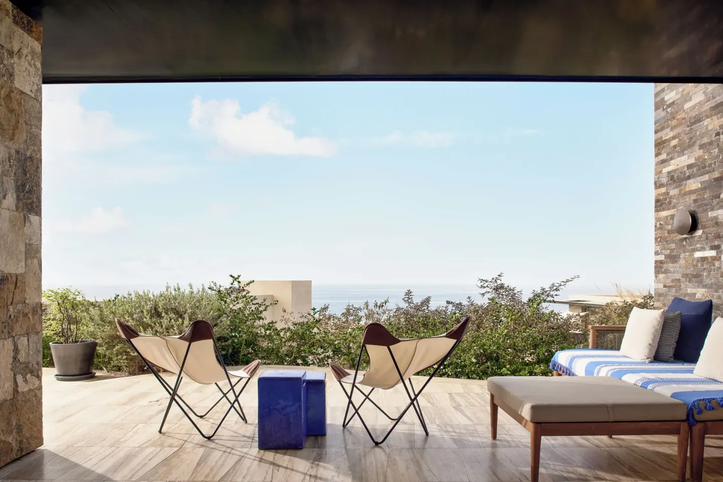 Covered oceanfront terrace with lounge seating at Zadún, a Ritz-Carlton Reserve, Los Cabos.