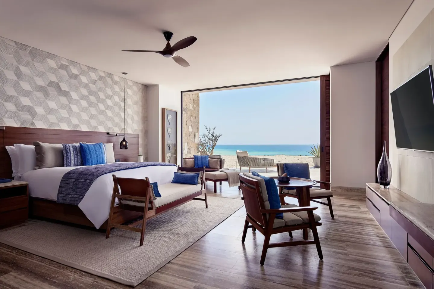 Suite bedroom with king bed and ocean-facing terrace at Zadún, a Ritz-Carlton Reserve, Los Cabos.