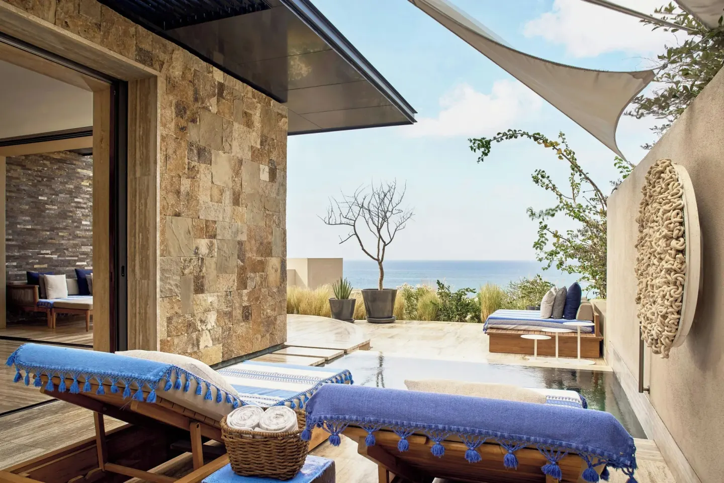 Suite terrace with pool, loungers, and sea view at Zadún, a Ritz-Carlton Reserve, Los Cabos.