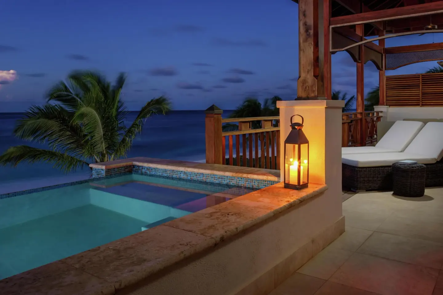 Lantern-lit private pool terrace beside the ocean at Zemi Beach House.