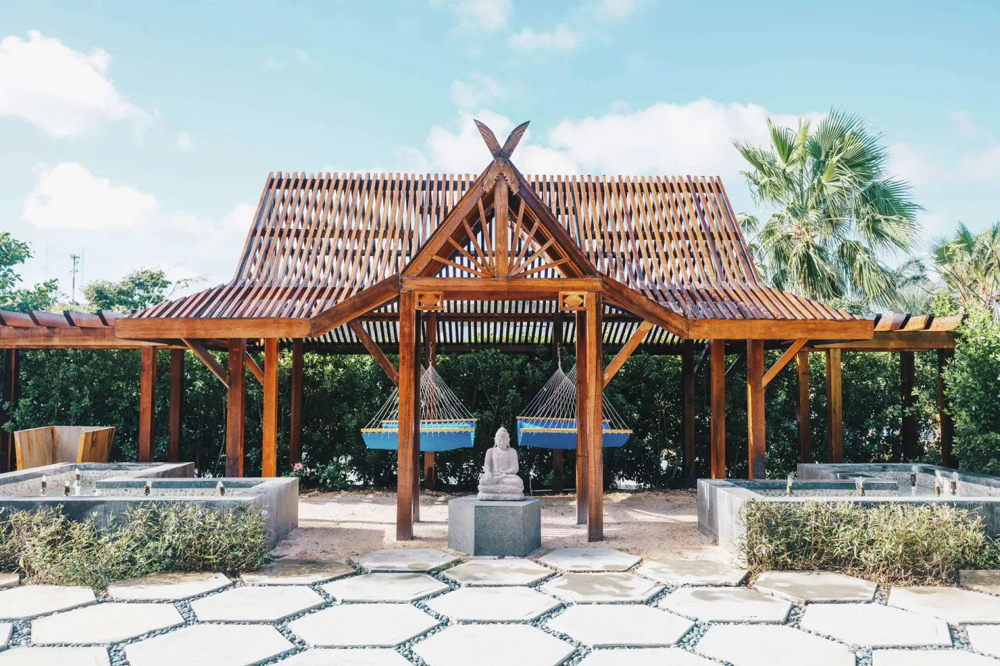 Open-air spa pavilion with hammocks and soaking tubs at Zemi Beach House.