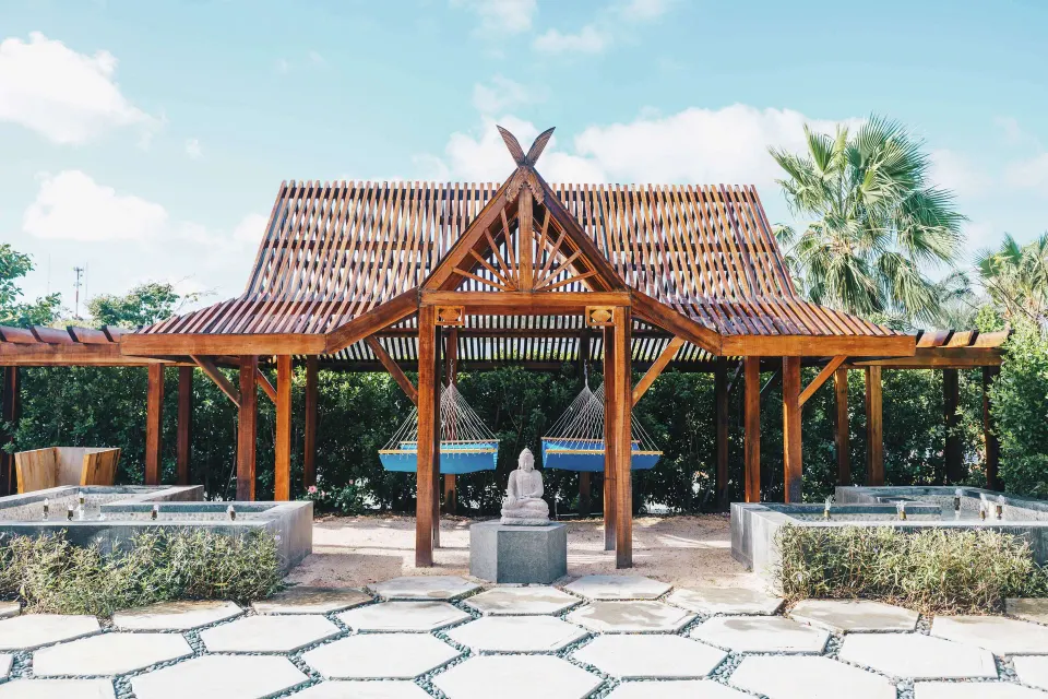 Open-air spa pavilion with hammocks and soaking tubs at Zemi Beach House.