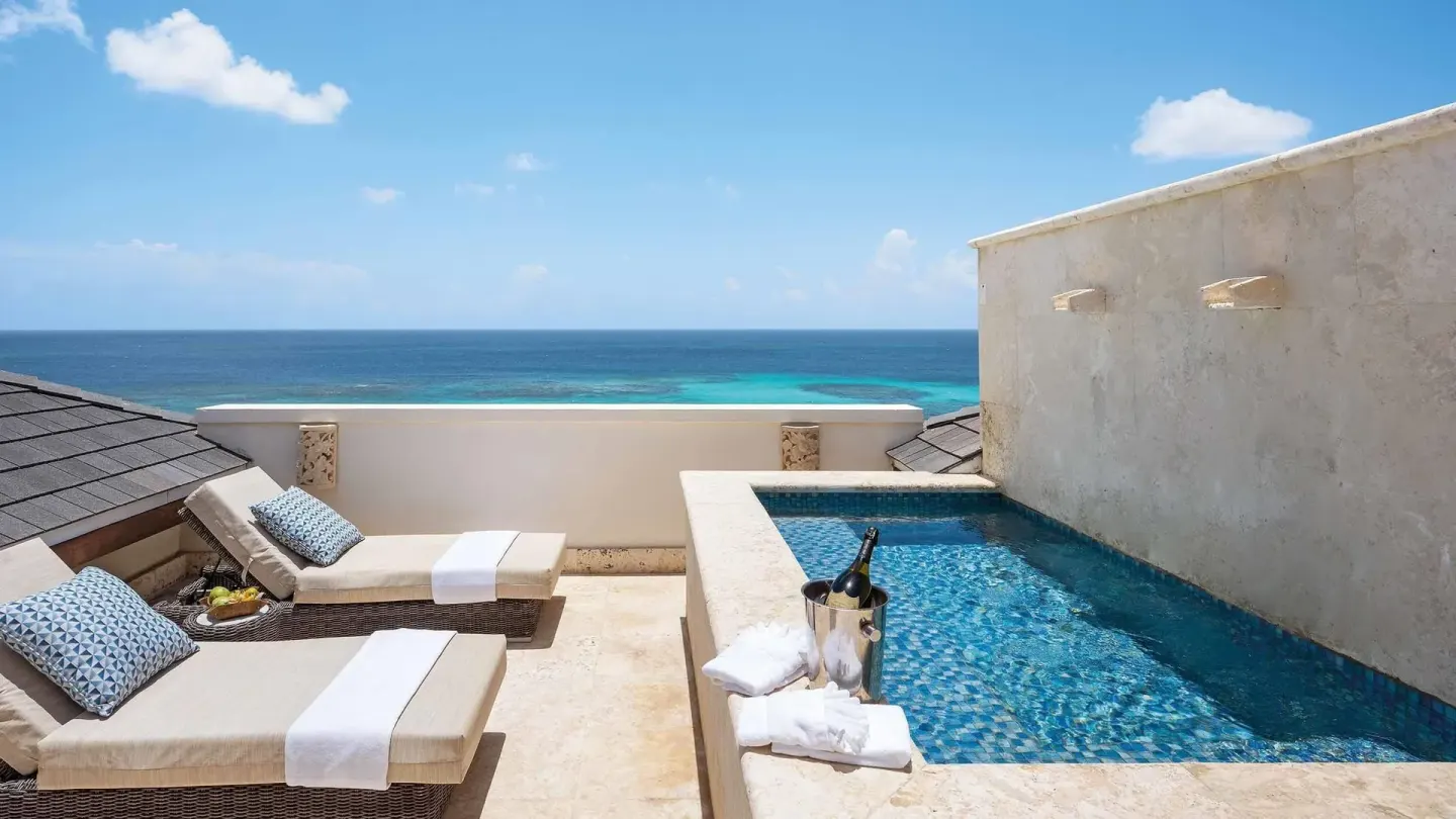 Private plunge pool terrace with loungers overlooking the ocean at Zemi Beach House.