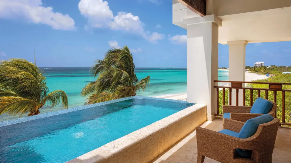 Private oceanfront plunge pool and balcony chairs at Zemi Beach House.
