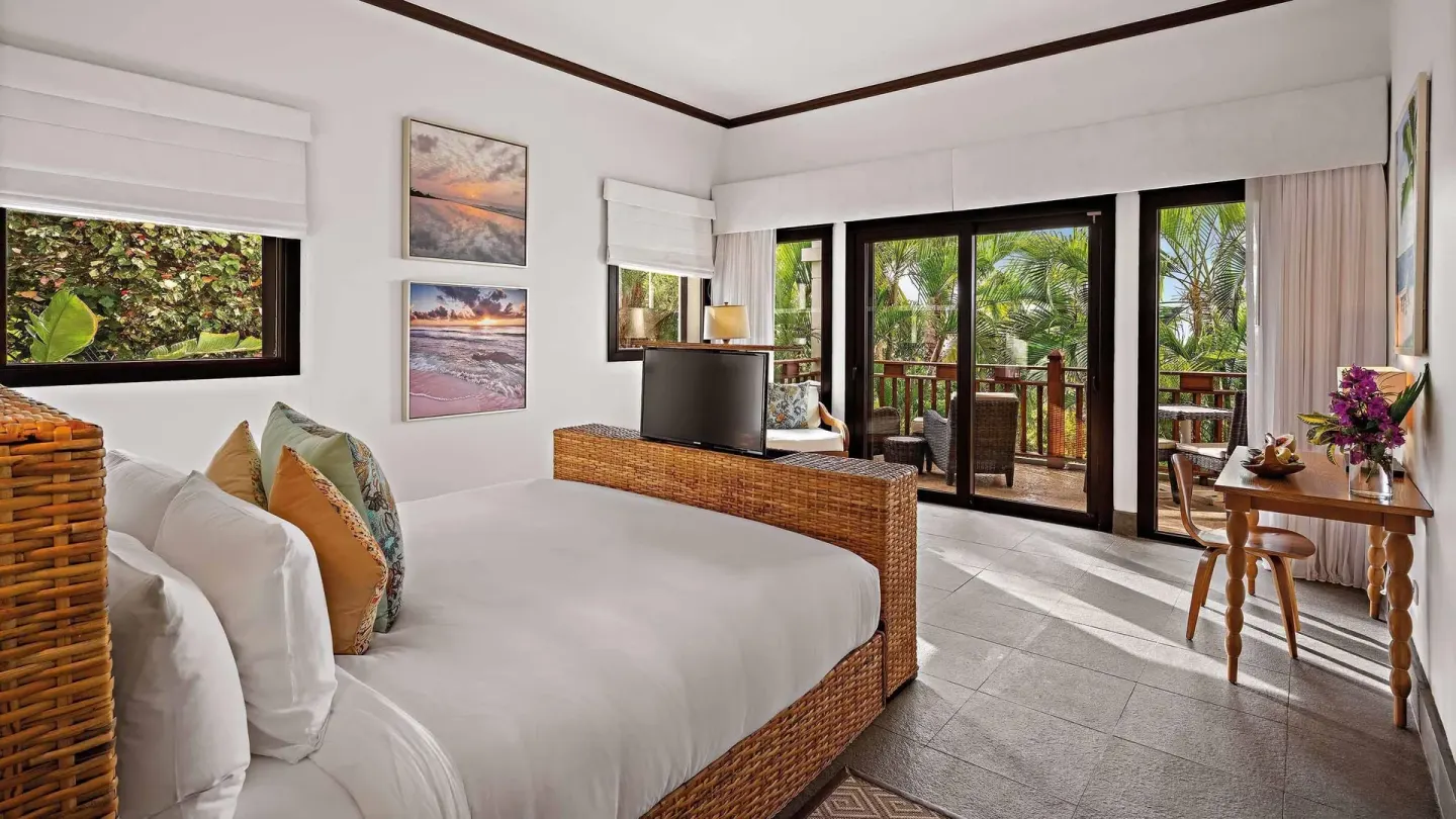 King-bedded Garden View Room with balcony doors and desk at Zemi Beach House.